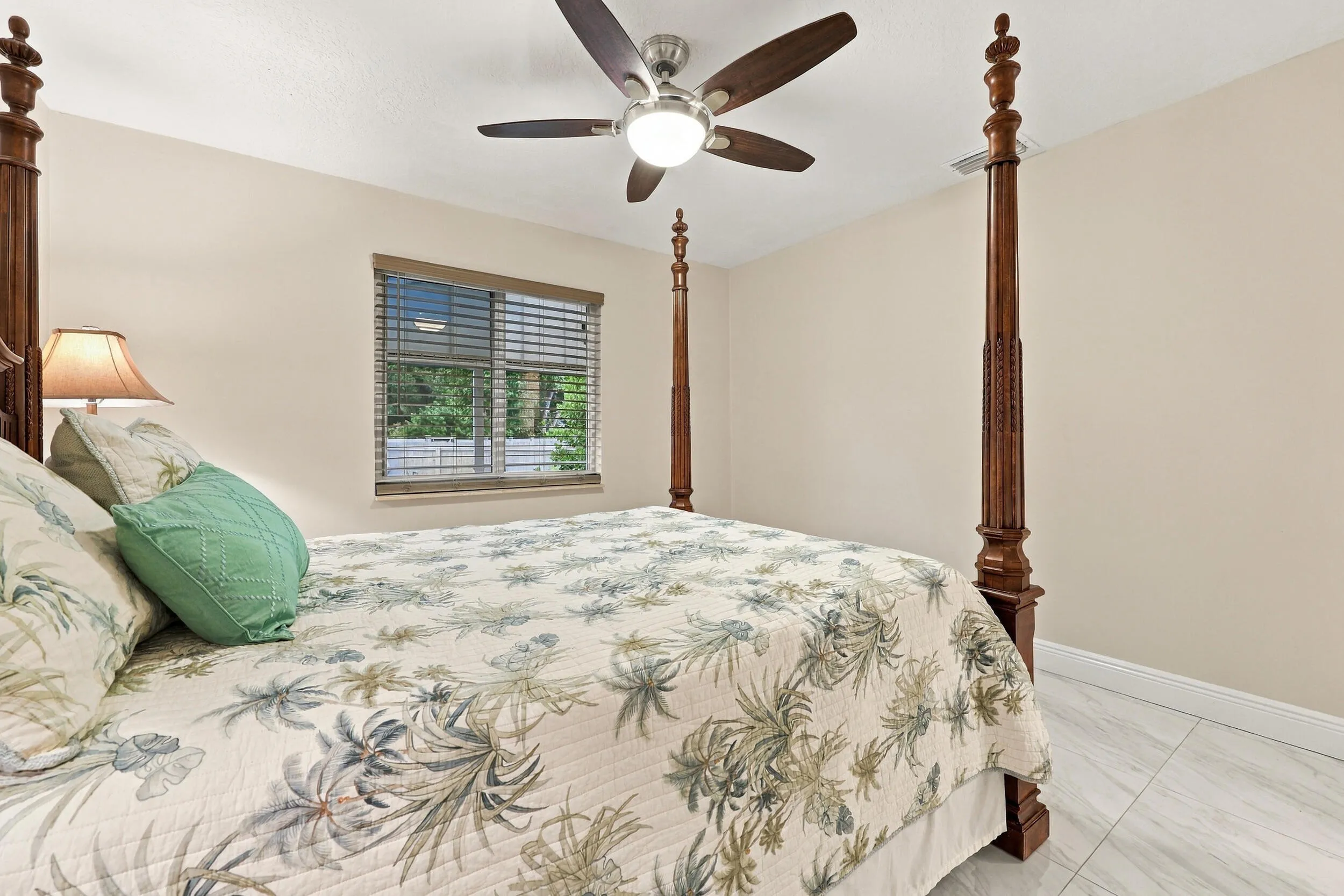 Guest bedroom 3 offers lots of natural light through a hurricane impact glass window and lots of closet space.