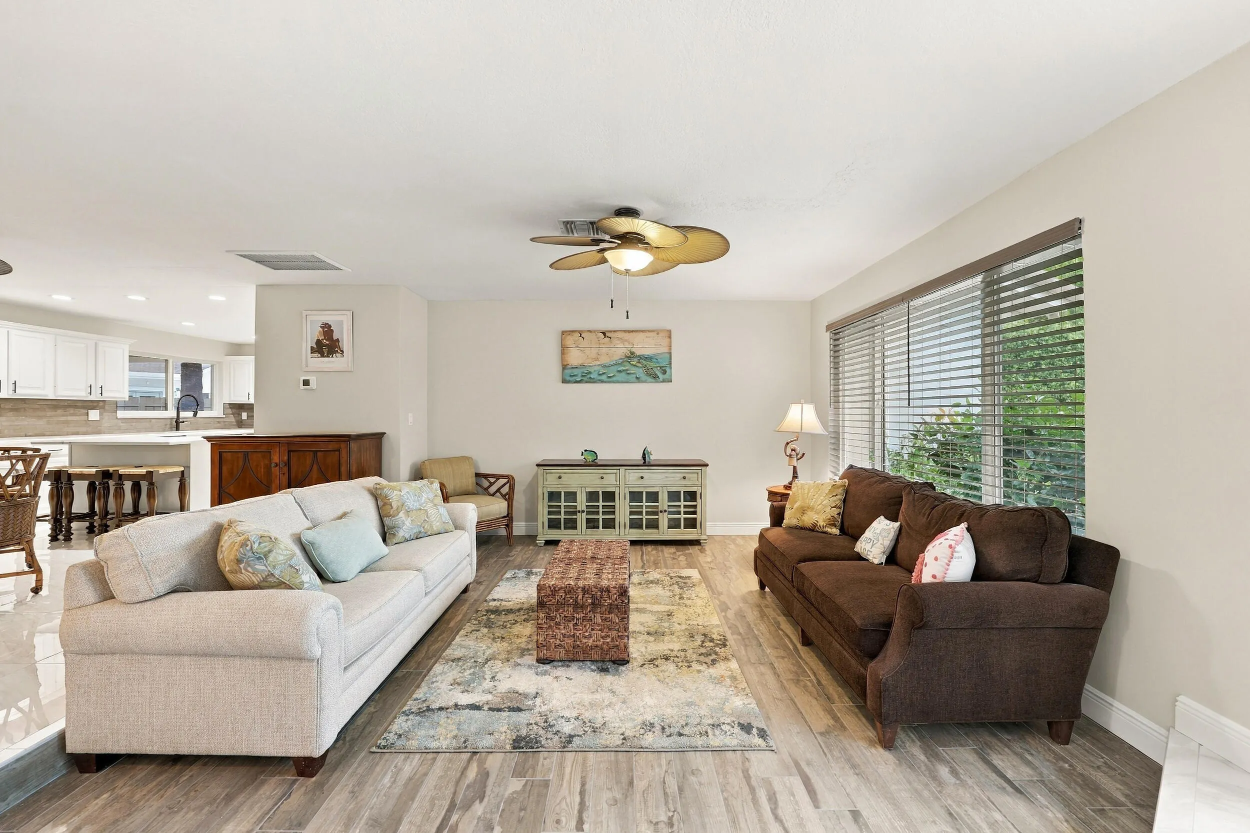 A spacious and versatile floor plan offers a formal living area that flows nicely into the updated kitchen and then into a family or bonus room. Everything revolves around the pool, the resort-style pool, and the 900-square-foot covered, screened-in patio.