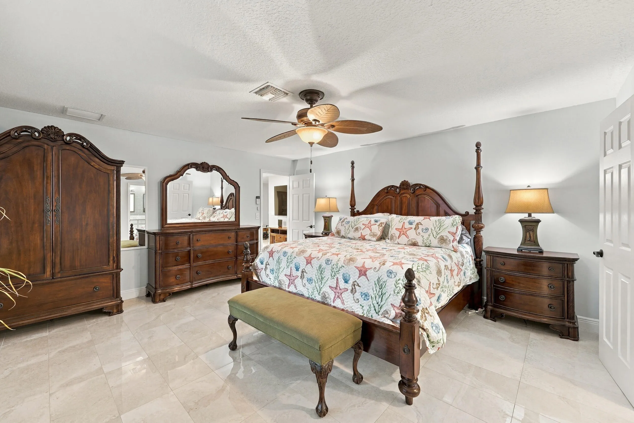 The primary suite has everything you have been looking for: spacious and elegant, with a walk-in closet, a fully updated en-suite bathroom, and lots of natural light.