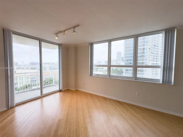 Bright living room with balcony.