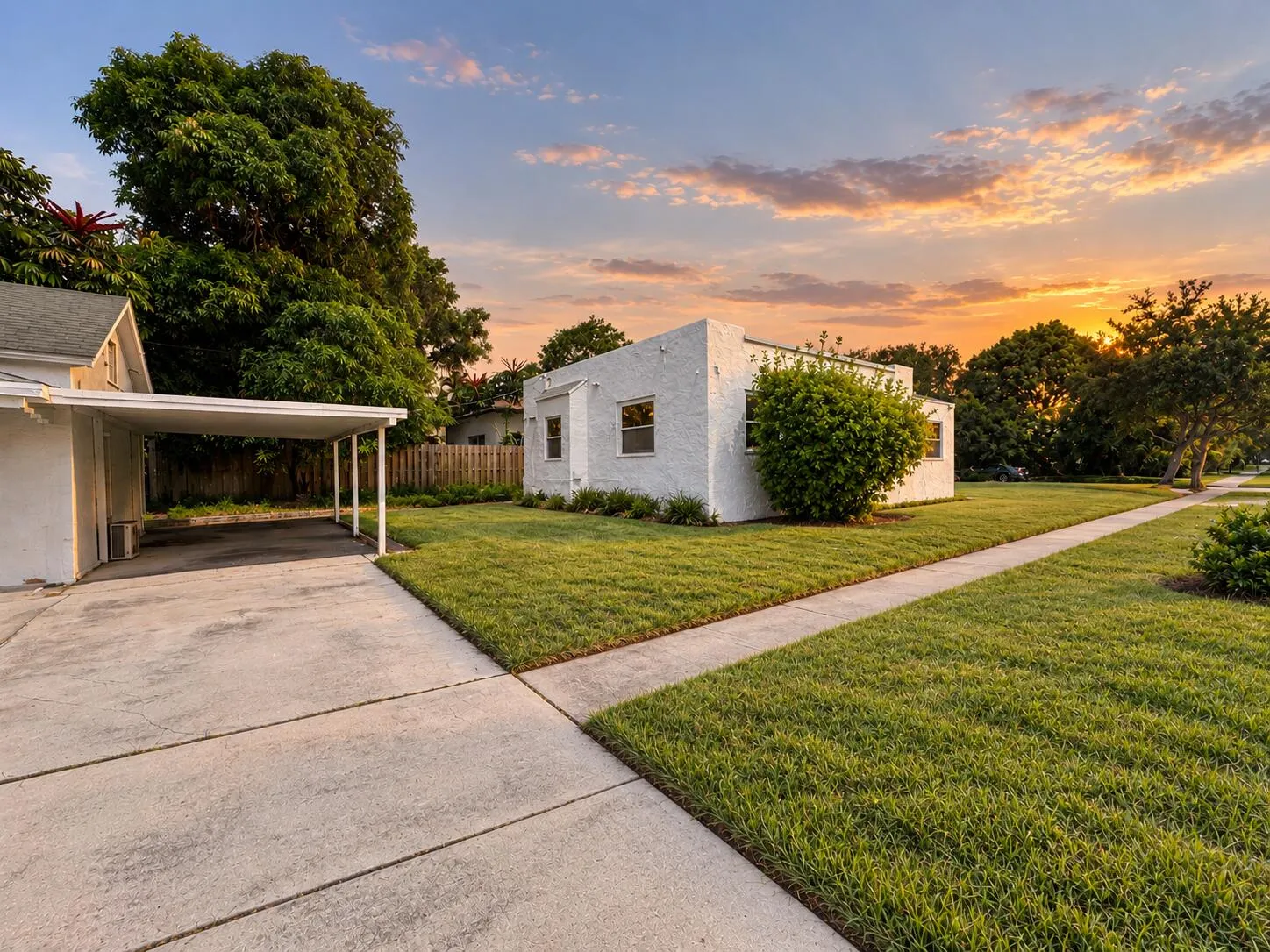 Separate rear cottage with its own covered carport, offering added flexibility for guests, extended family or potential rental income.