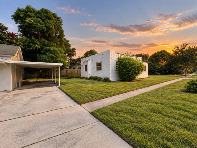 Separate rear cottage with its own covered carport, offering added flexibility for guests, extended family or potential rental income.