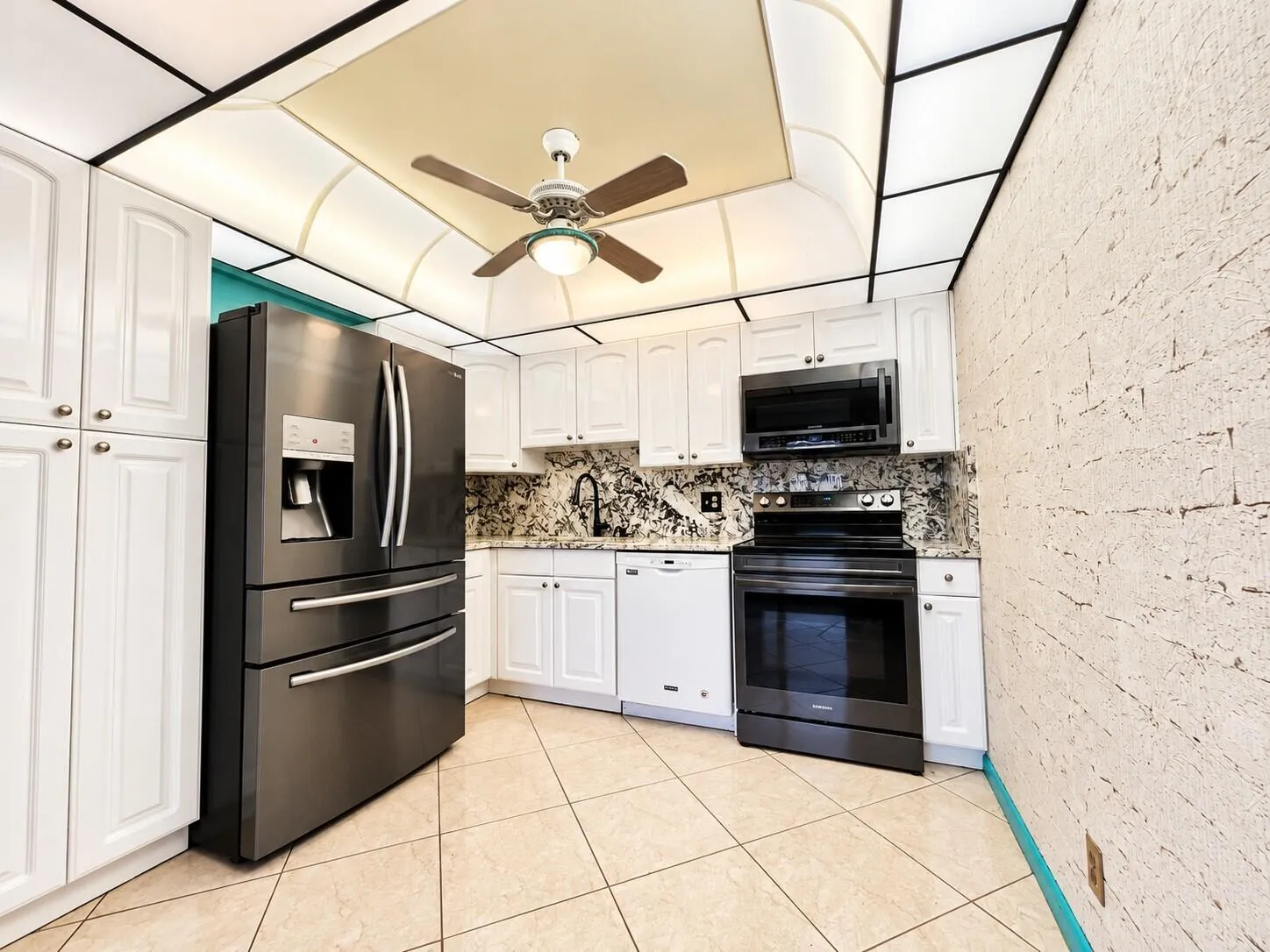 Pretty Updated Kitchen With White Cabinets and Upgraded Appliances