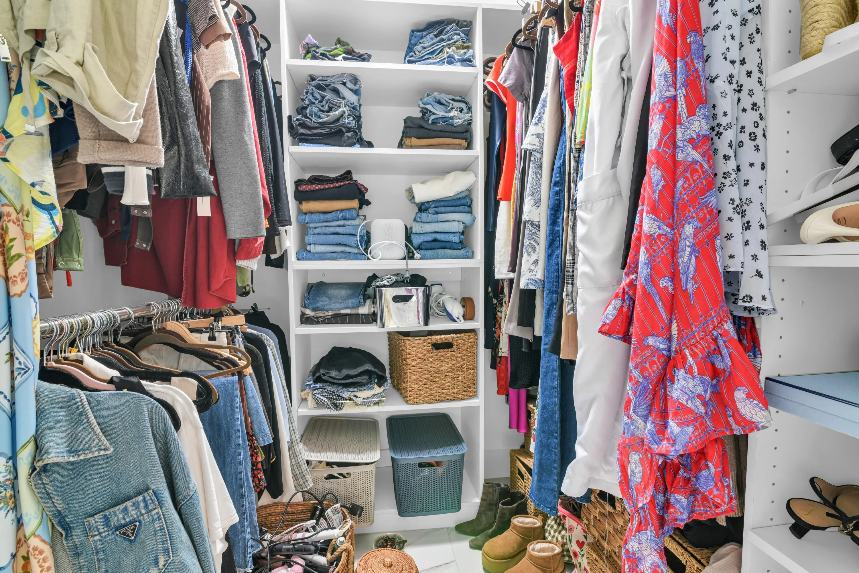 Custom closet system featuring multiple shelves and hanging rods