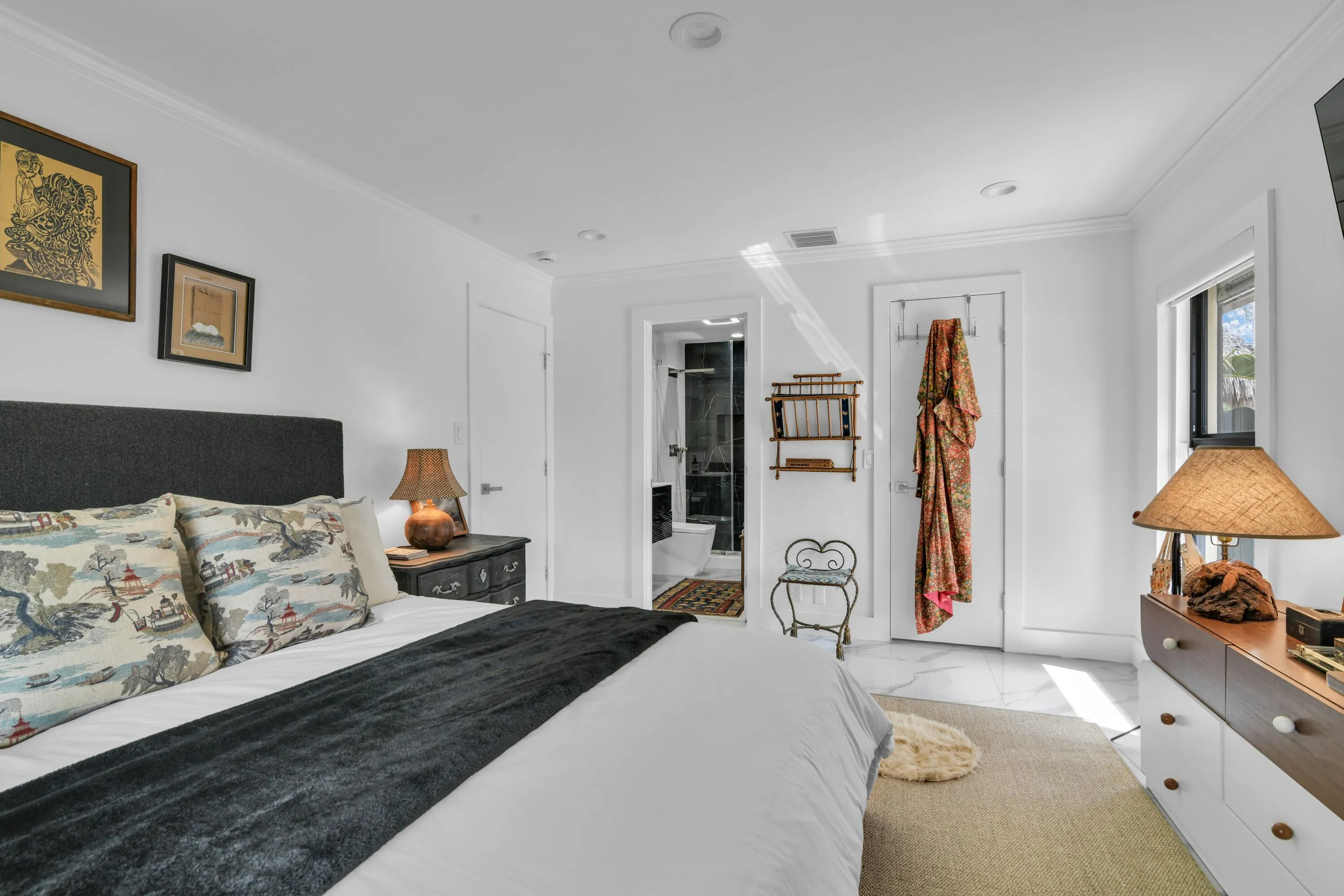 White walls with crown molding, recessed lighting, and a window with natural light