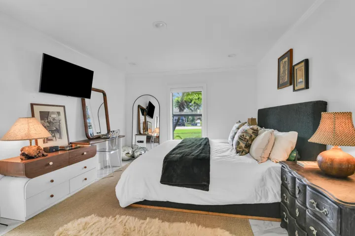 White wall finishes, crown molding, and recessed lighting
