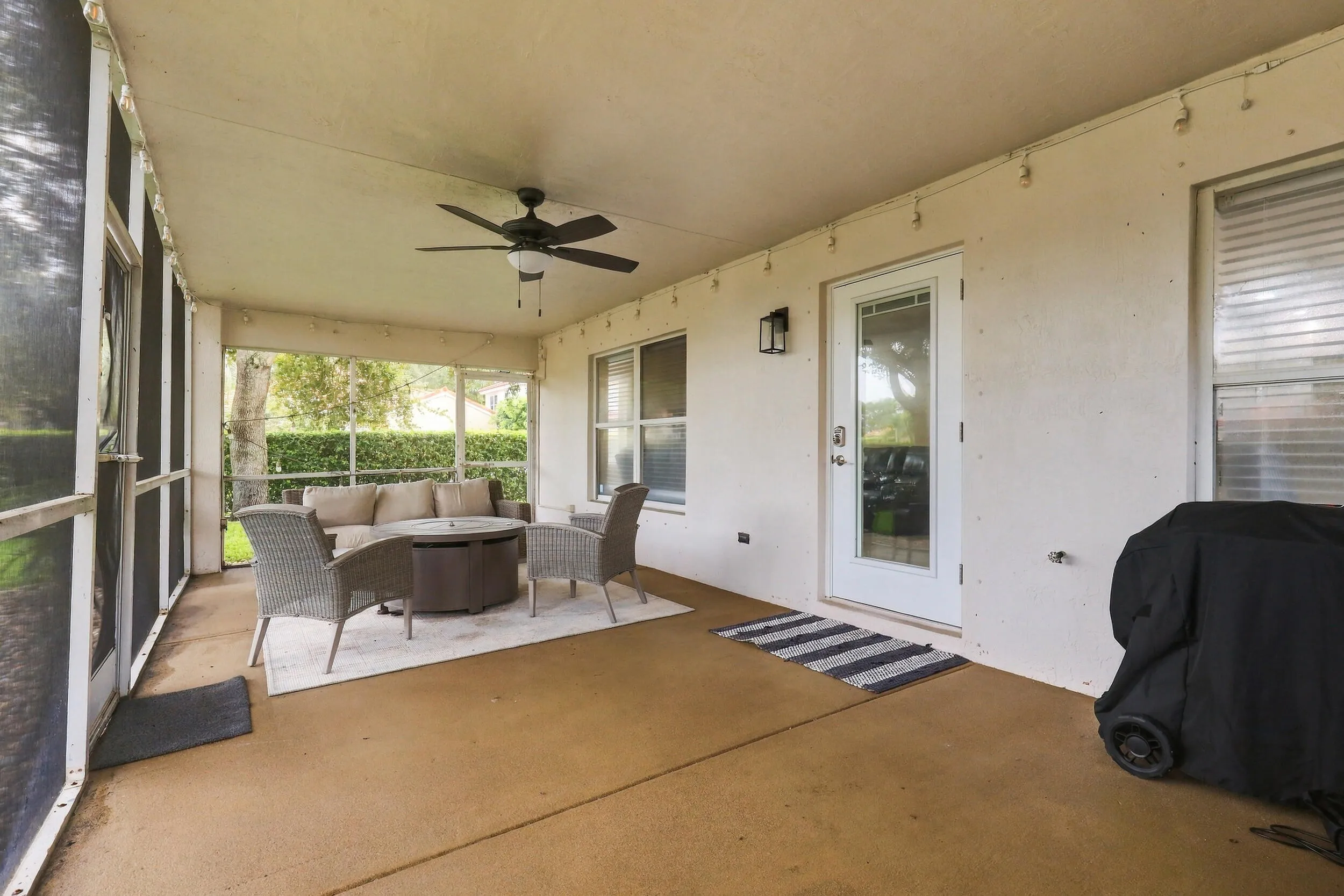 A 360 square foot covered and screened patio dramatically expands the home's entertaining space, with plenty of room to create both an outdoor living room and dining area for year round enjoyment. Whether hosting family and friends, dining outside, or simply unwinding at the end of the day, the combination of the expansive screened patio, lush hedges, full fencing, and complete rear privacy makes this a truly special outdoor setting.