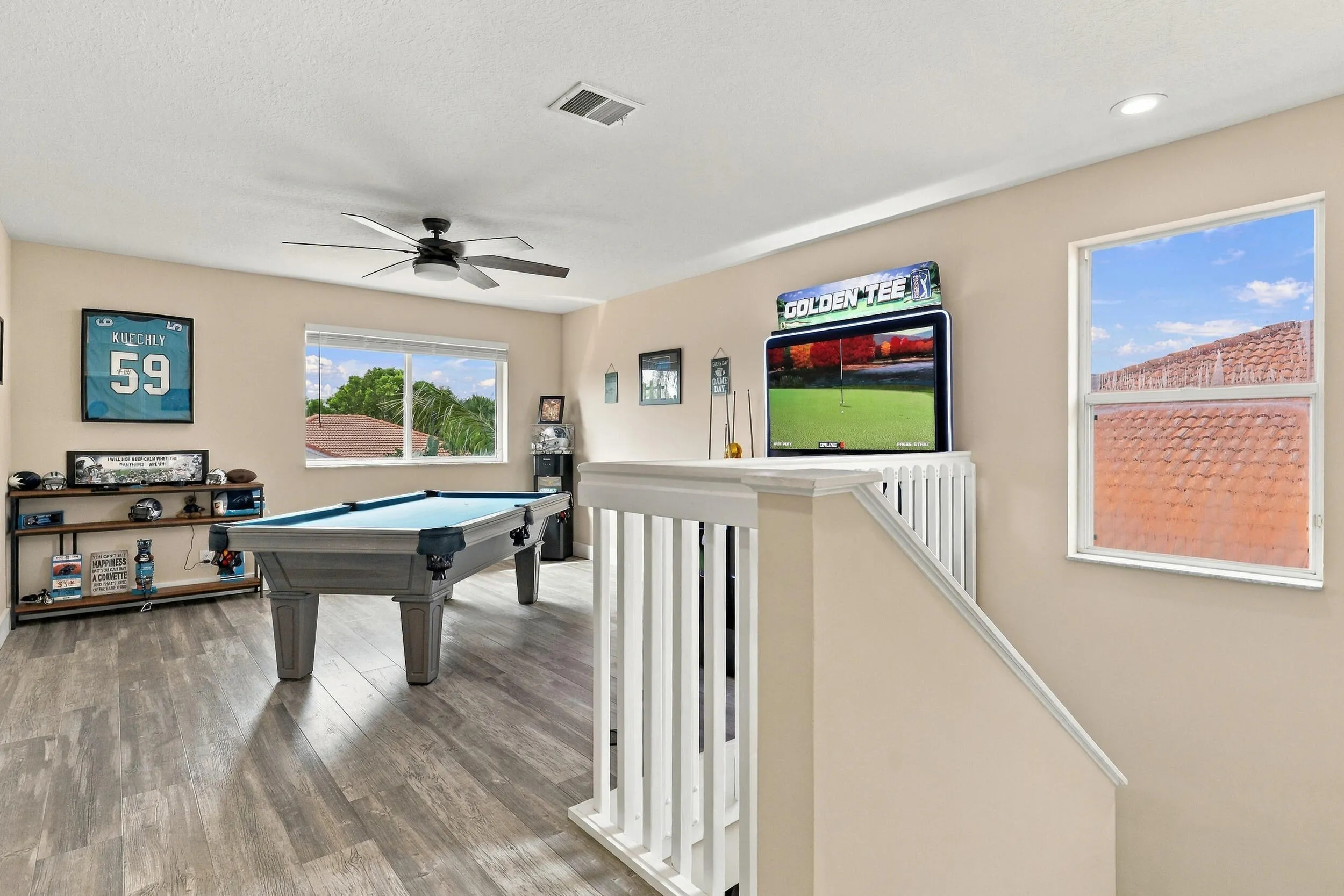 Upstairs is an entertainer's dream. The loft space (which could be a fifth bedroom) is currently a game room with a pool table, arcade games, and is a great space to relax and unwind. This home is being sold fully furnished!