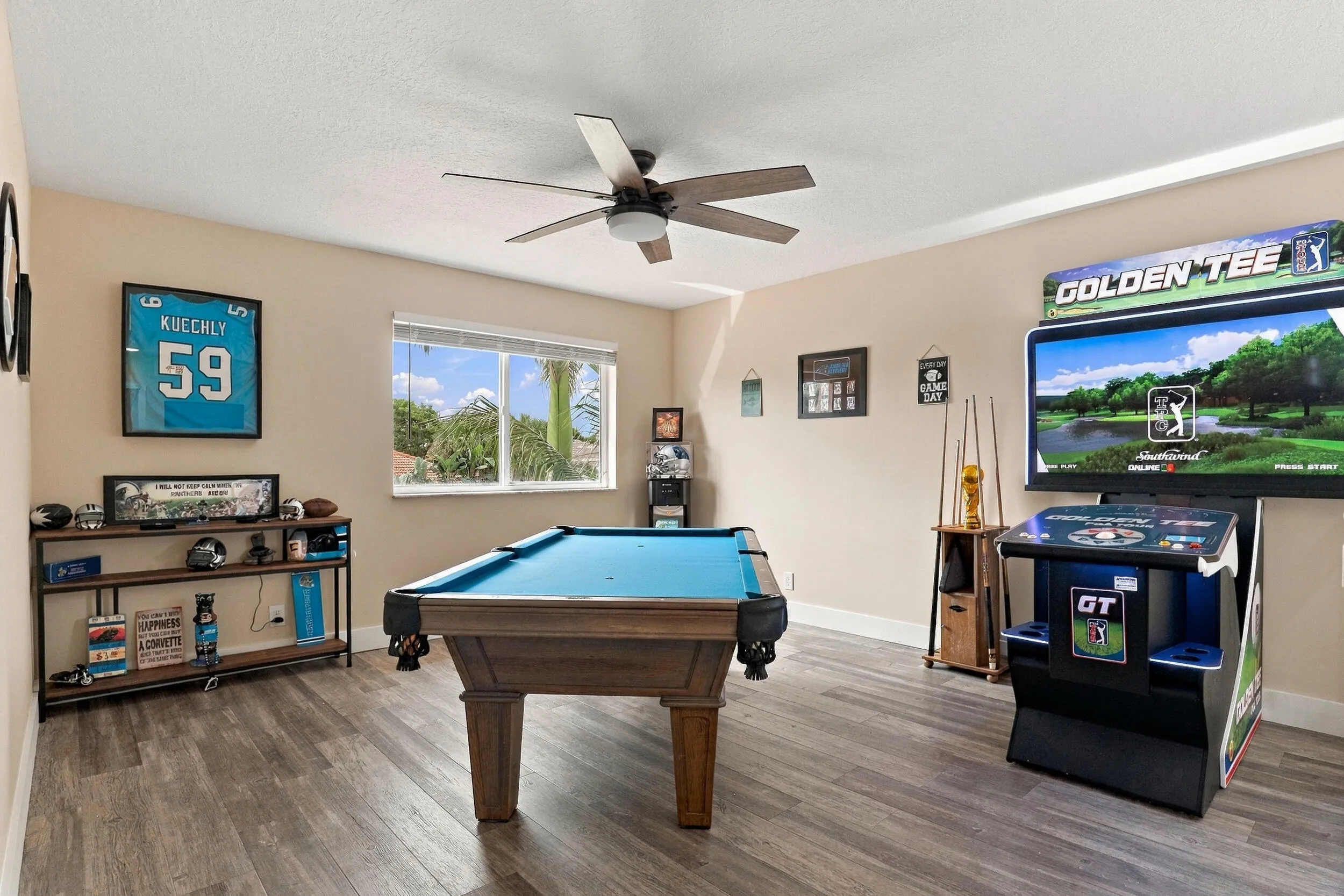 Upstairs is an entertainer's dream. The loft space (which could be a fifth bedroom) is currently a game room with a pool table, arcade games, and is a great space to relax and unwind. This home is being sold fully furnished!