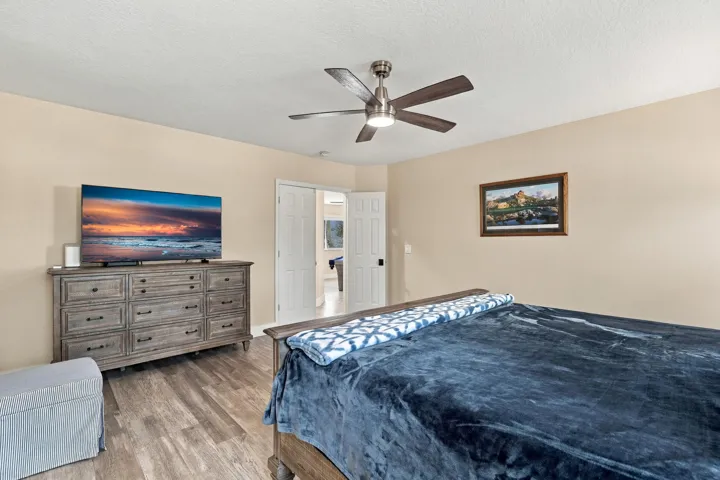 The primary suite is enormous! It offers lots of natural light, a spa-like ensuite bathroom with a marble shower, frameless glass, as well as a walk-in closet and soaking tub.