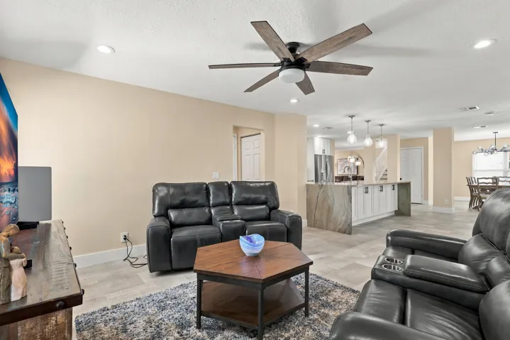 With an elegant and versatile floor plan, this home offers two distinct living areas on either side of the kitchen, creating a circular flow to the home's layout.