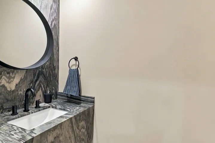 A stunning and dramatic powder room on the first floor awaits all of your guests.