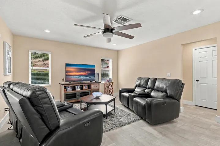 With an elegant and versatile floor plan, this home offers two distinct living areas on either side of the kitchen, creating a circular flow to the home's layout.