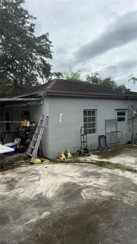 Rear exterior and carport area
