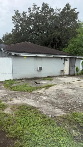 Exterior view of the home on a large lot