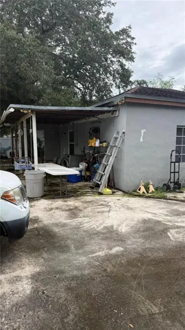 Rear exterior with covered carport