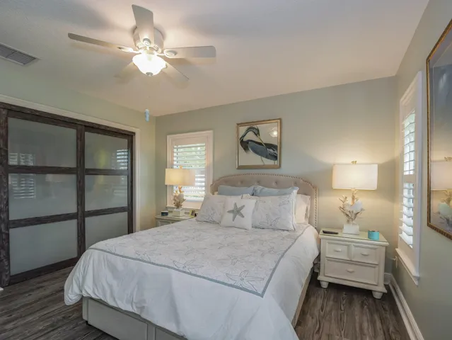 Second bedroom, frosted glass doors on closet.