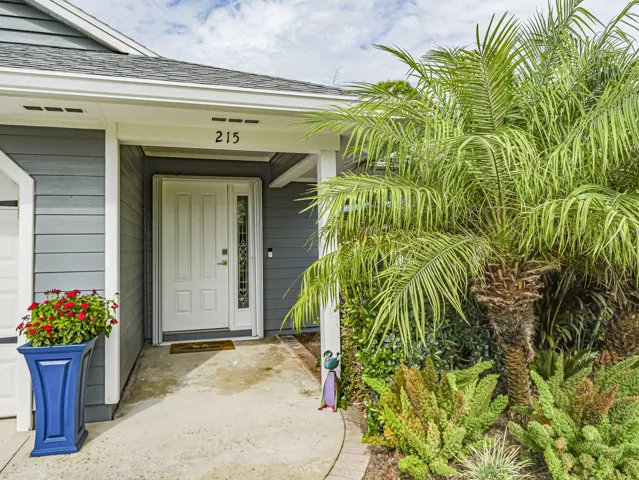 Covered entry, attractive landscaping.