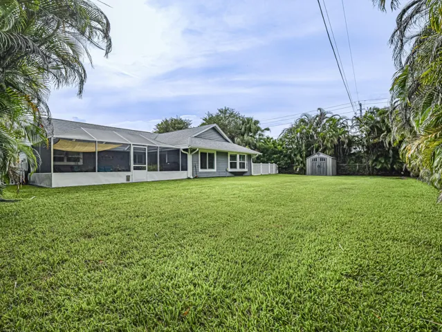 Expansive green lawn - room for pool.