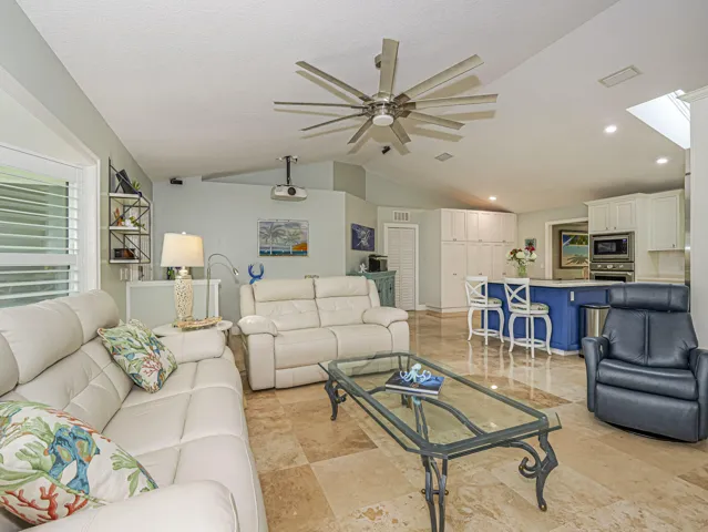 Cathedral ceilings in open and welcoming living area