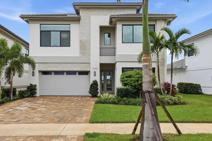 Contemporary two-story exterior with stone accents and a flat roofline