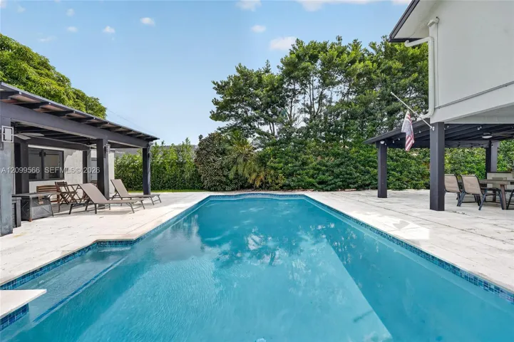 spacious back yard with a heated pool