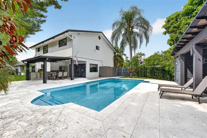 spacious back yard with a heated pool