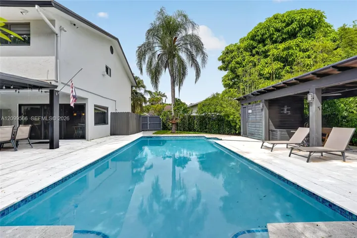 spacious back yard with a heated pool