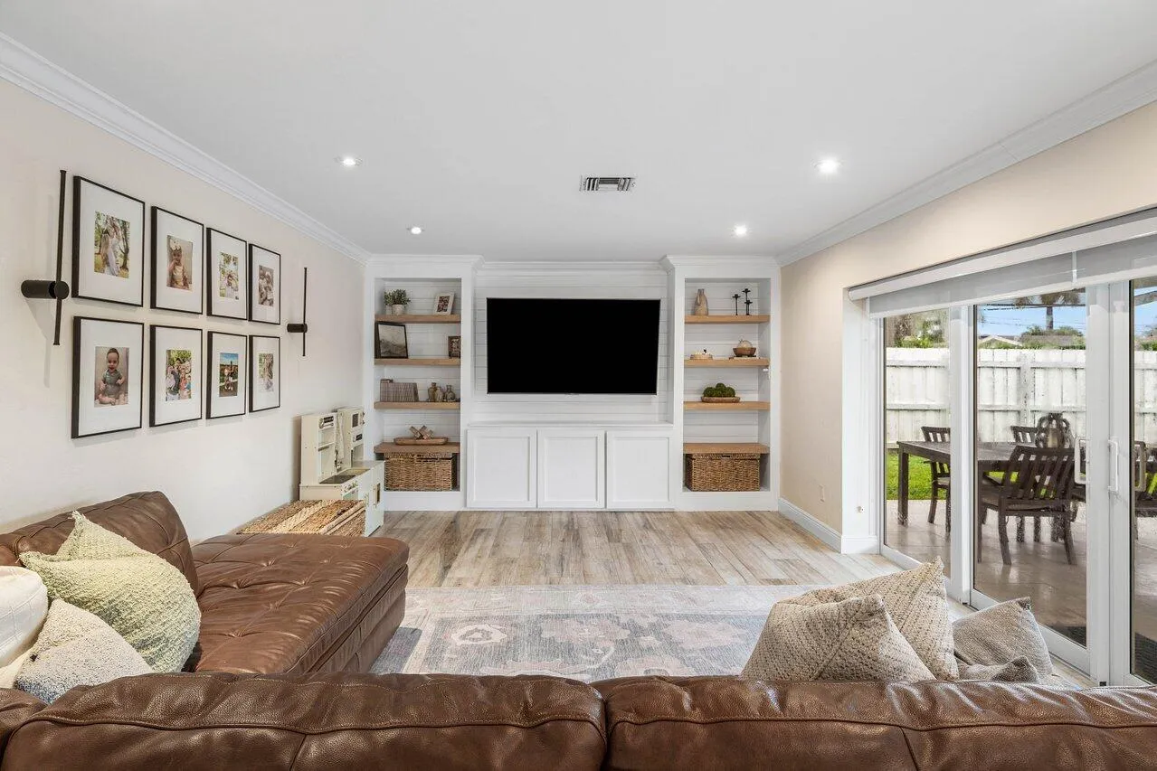 Built-in shelving and patio access.