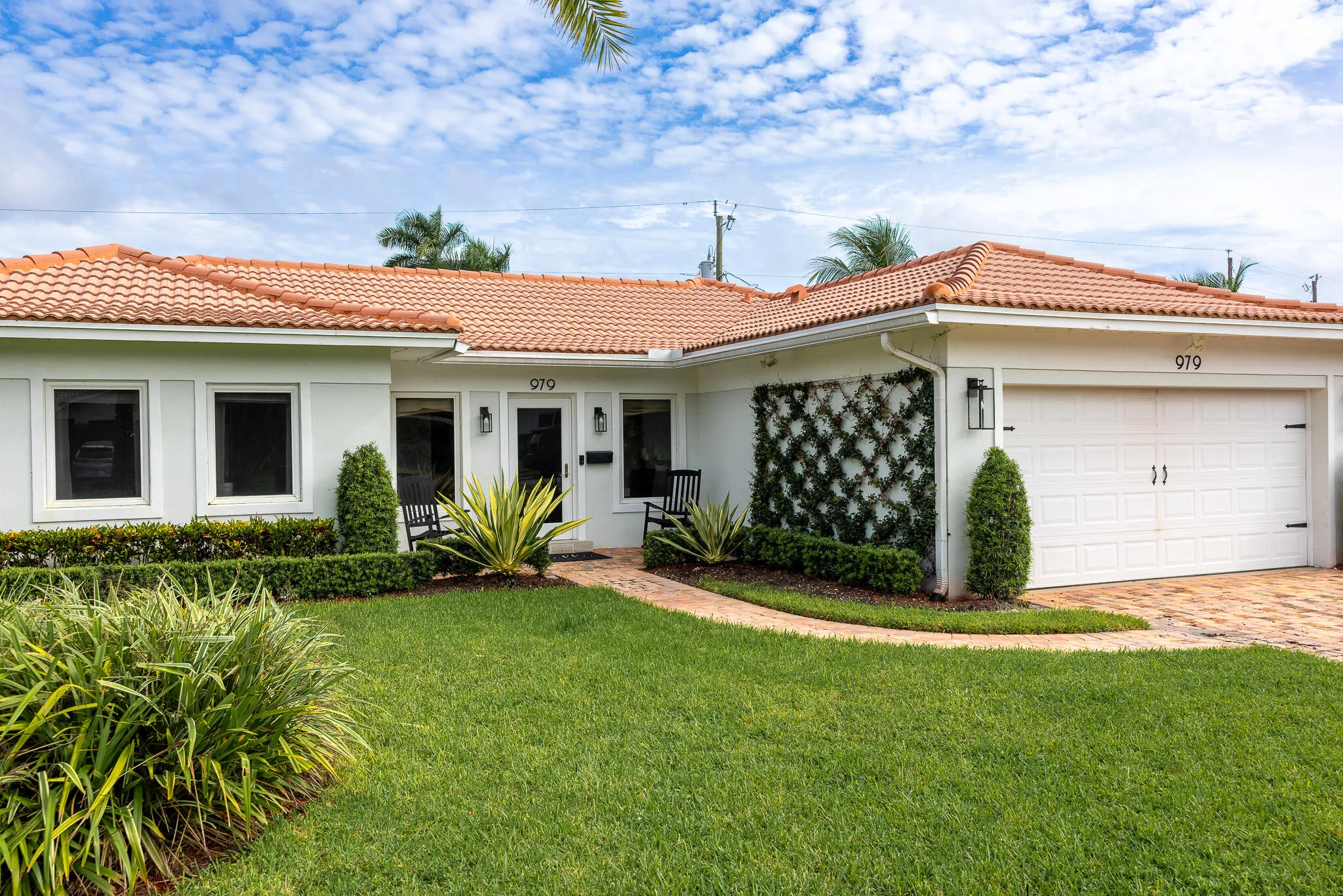 Covered entry and landscaped walkway.