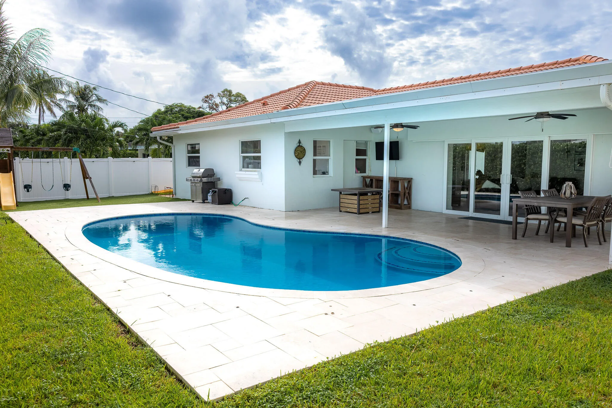 Poolside dining and covered patio.