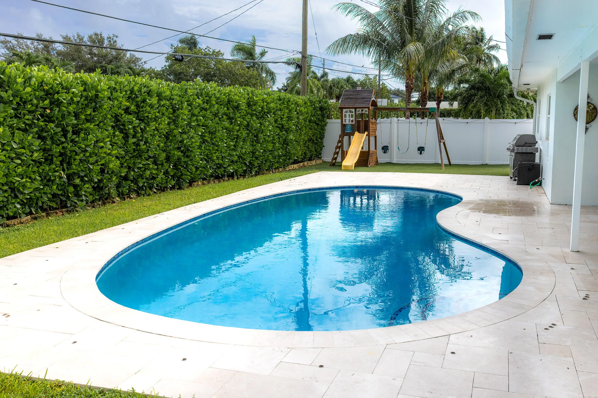 Pool surrounded by a spacious deck.