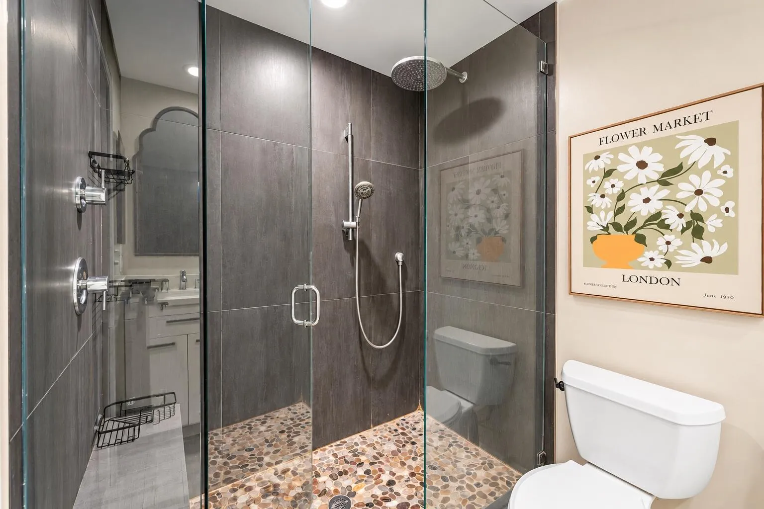Glass enclosure and rainfall showerhead.