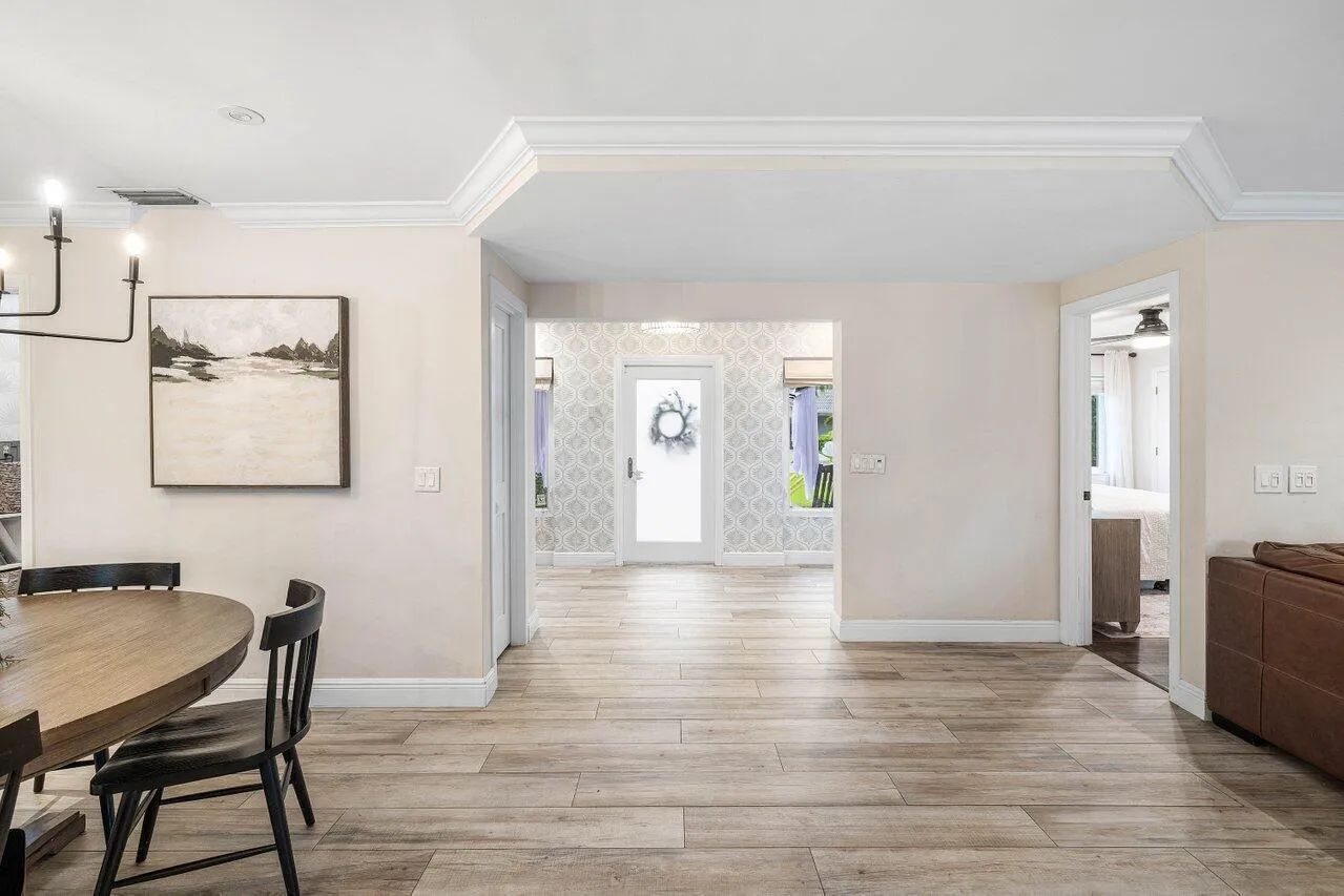 Wide sightlines and continuous flooring connect the main living areas to the entry.