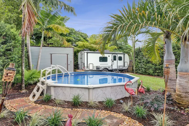 Backyard with saltwater pool and storage shed