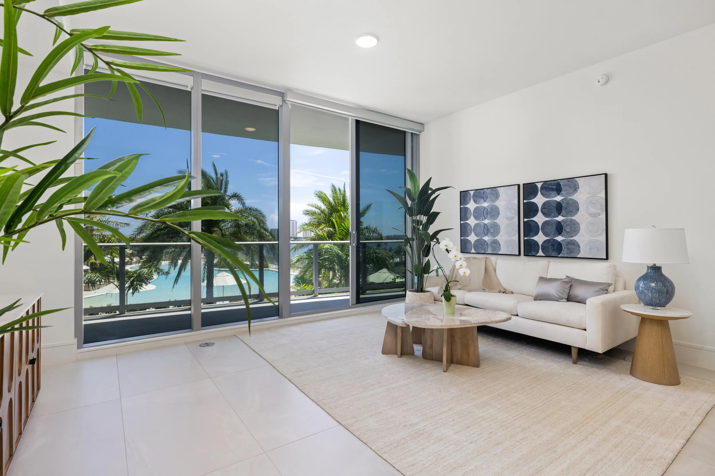 Floor-to-ceiling glass doors with roller shades