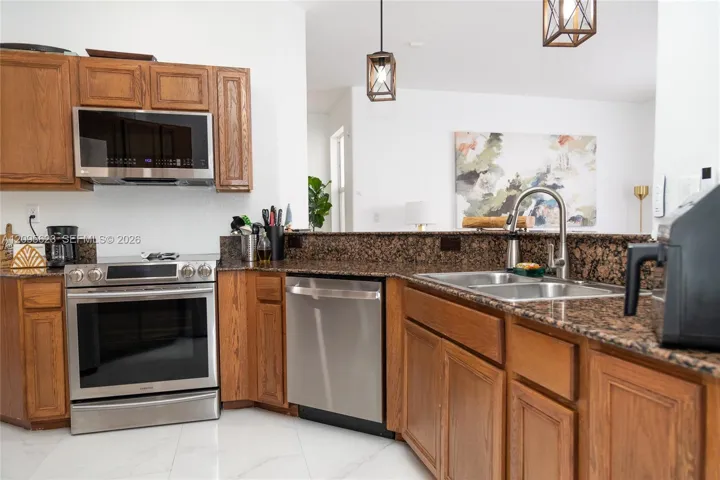 Spacious counter space and an open layout ideal for cooking and entertaining .