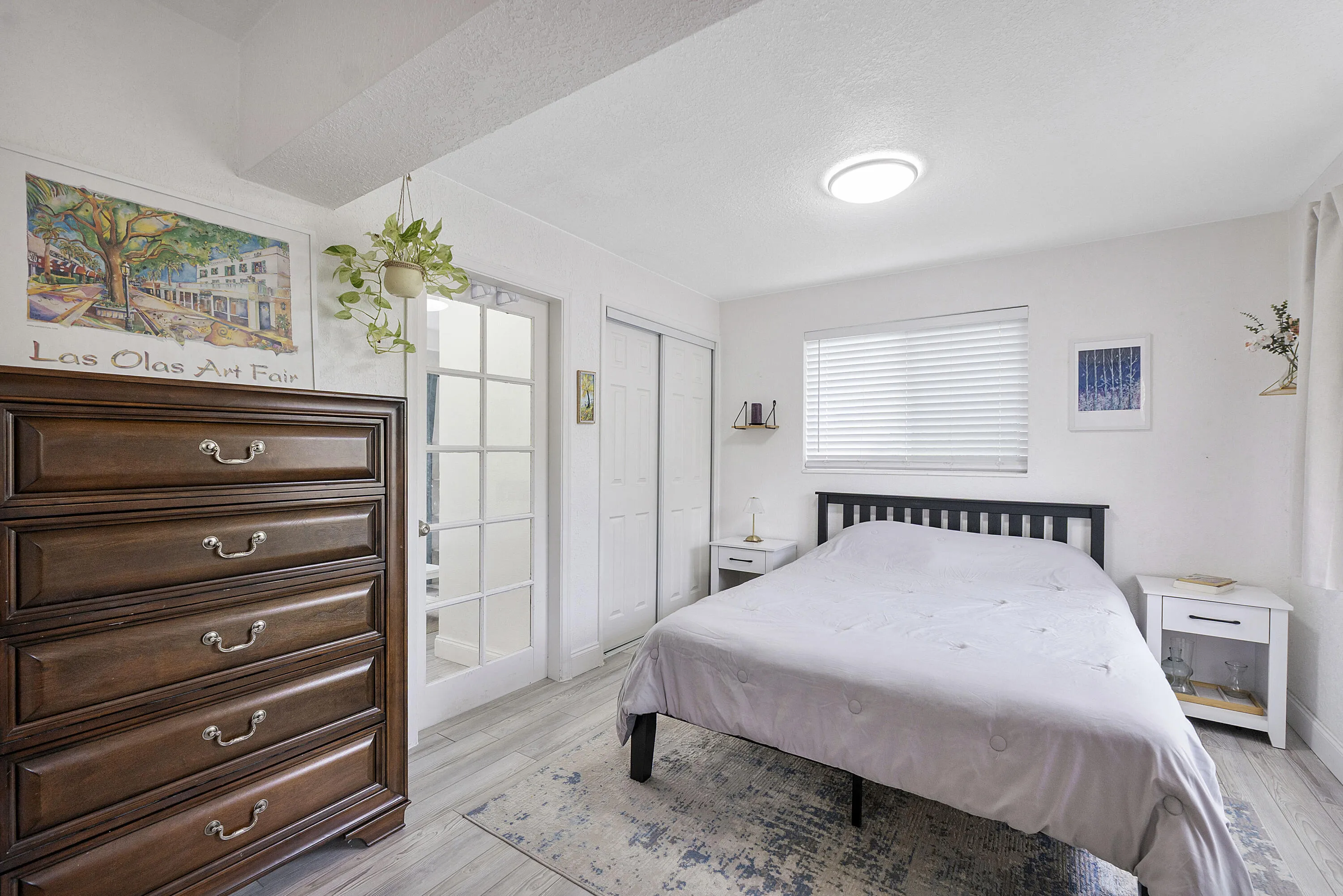bedroom with view of french door to sitting room.