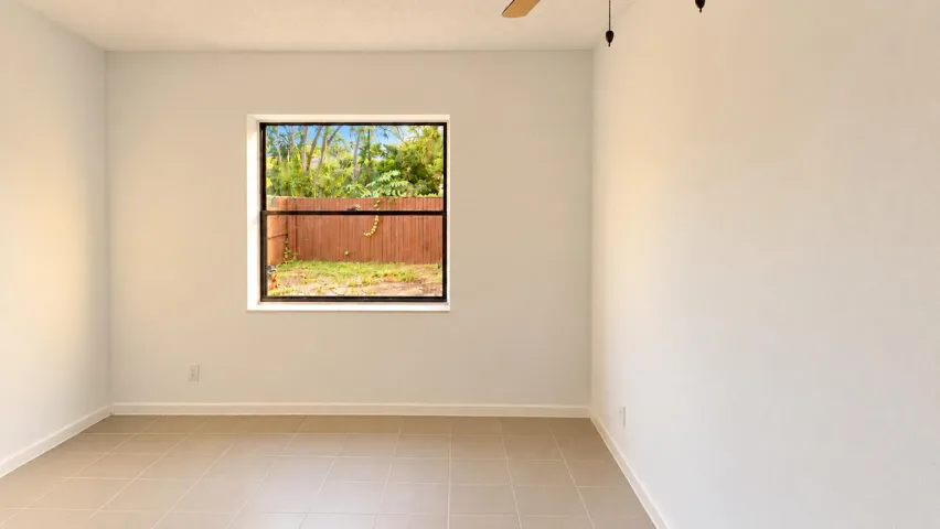 Bright Empty Room with Tropical Window