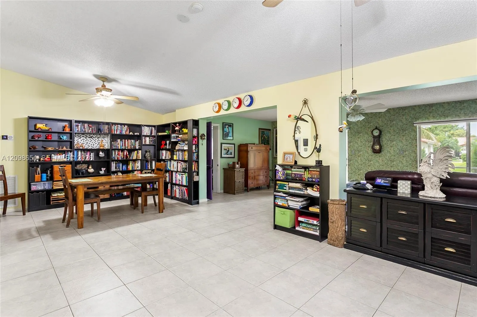 Dining Room with Library Bookshelves that can convey with the property