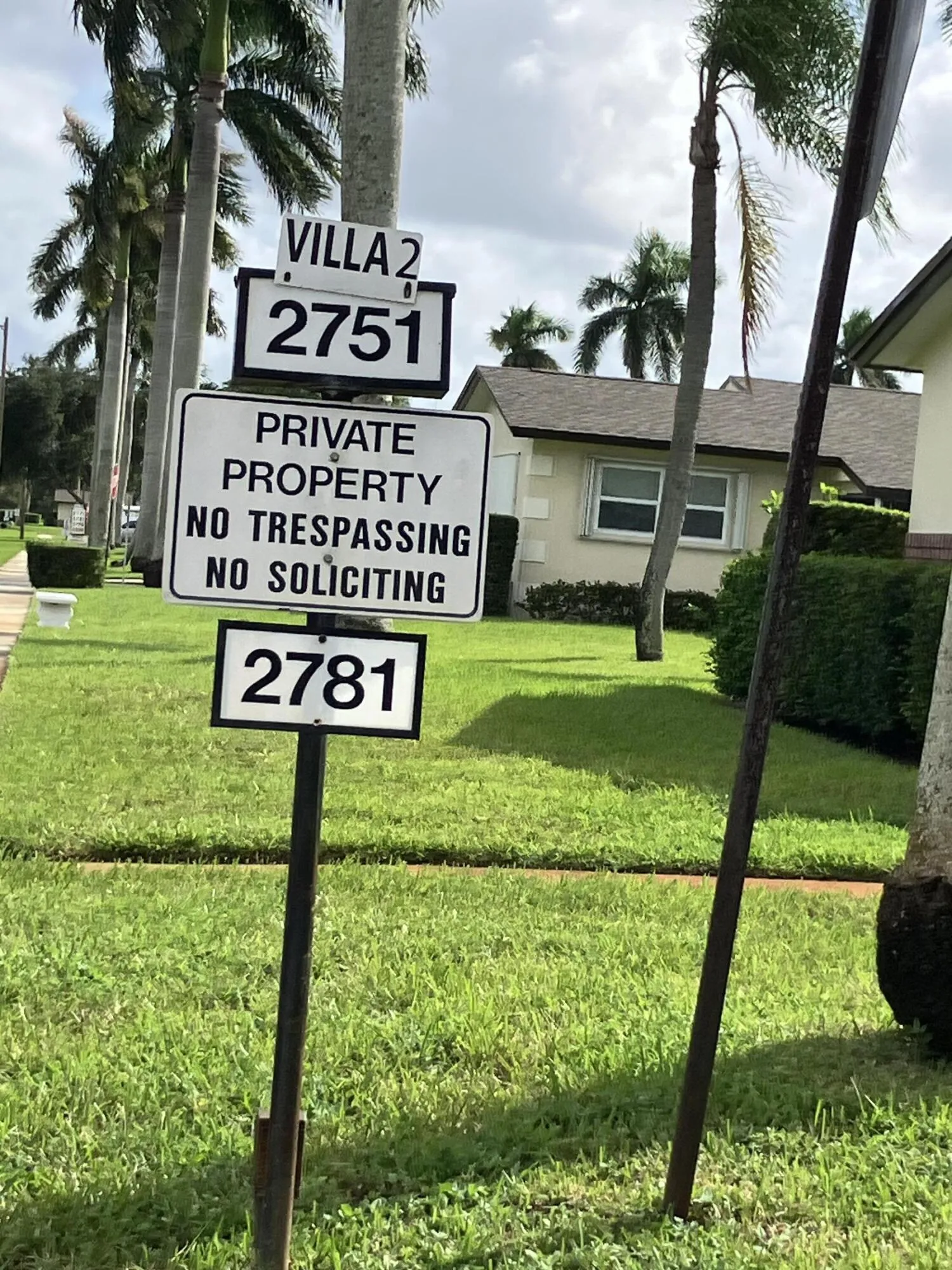 Sign showing entrance to villa 2 where the condo is located