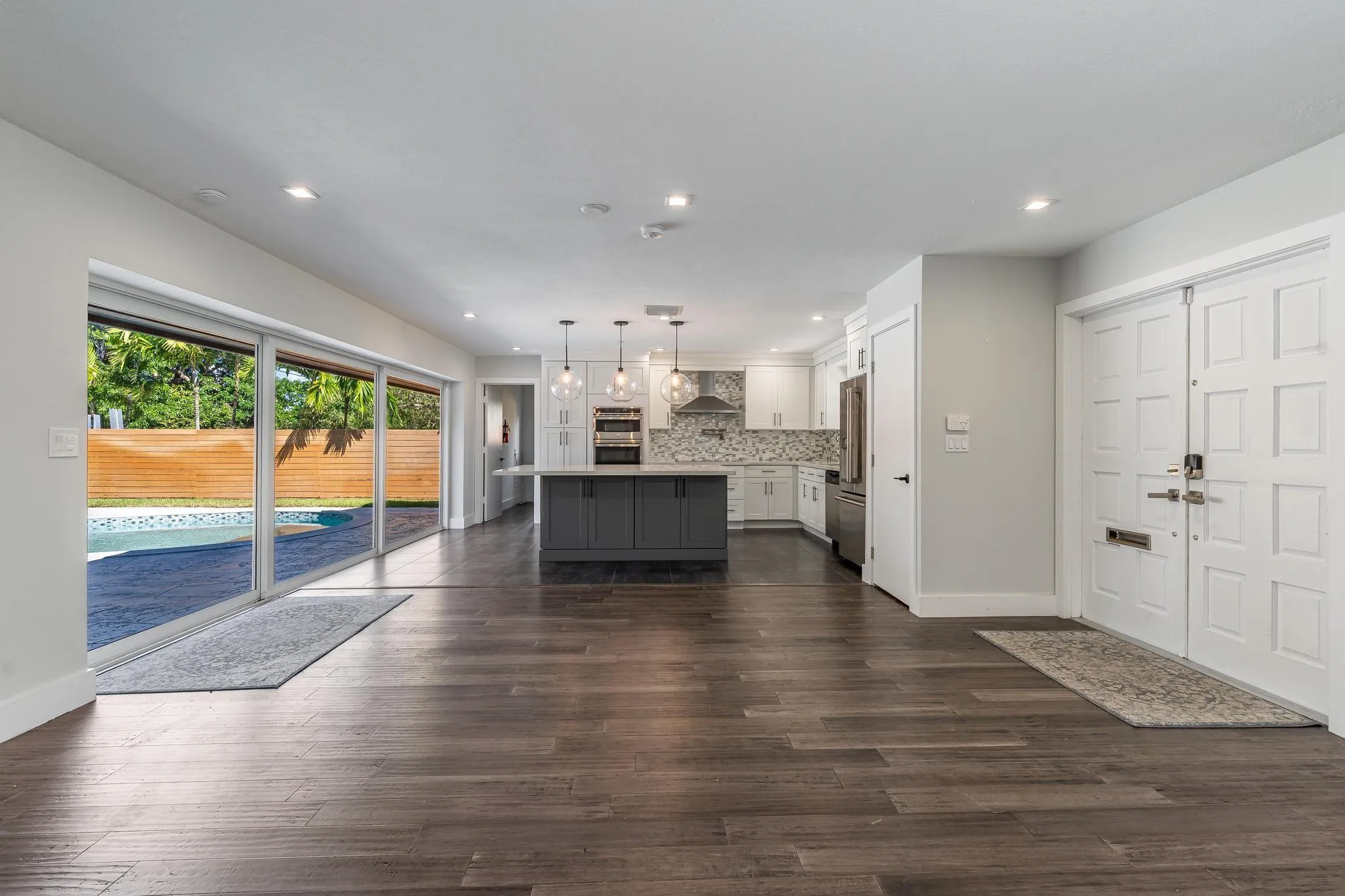 Open floor plan with sliding glass doors