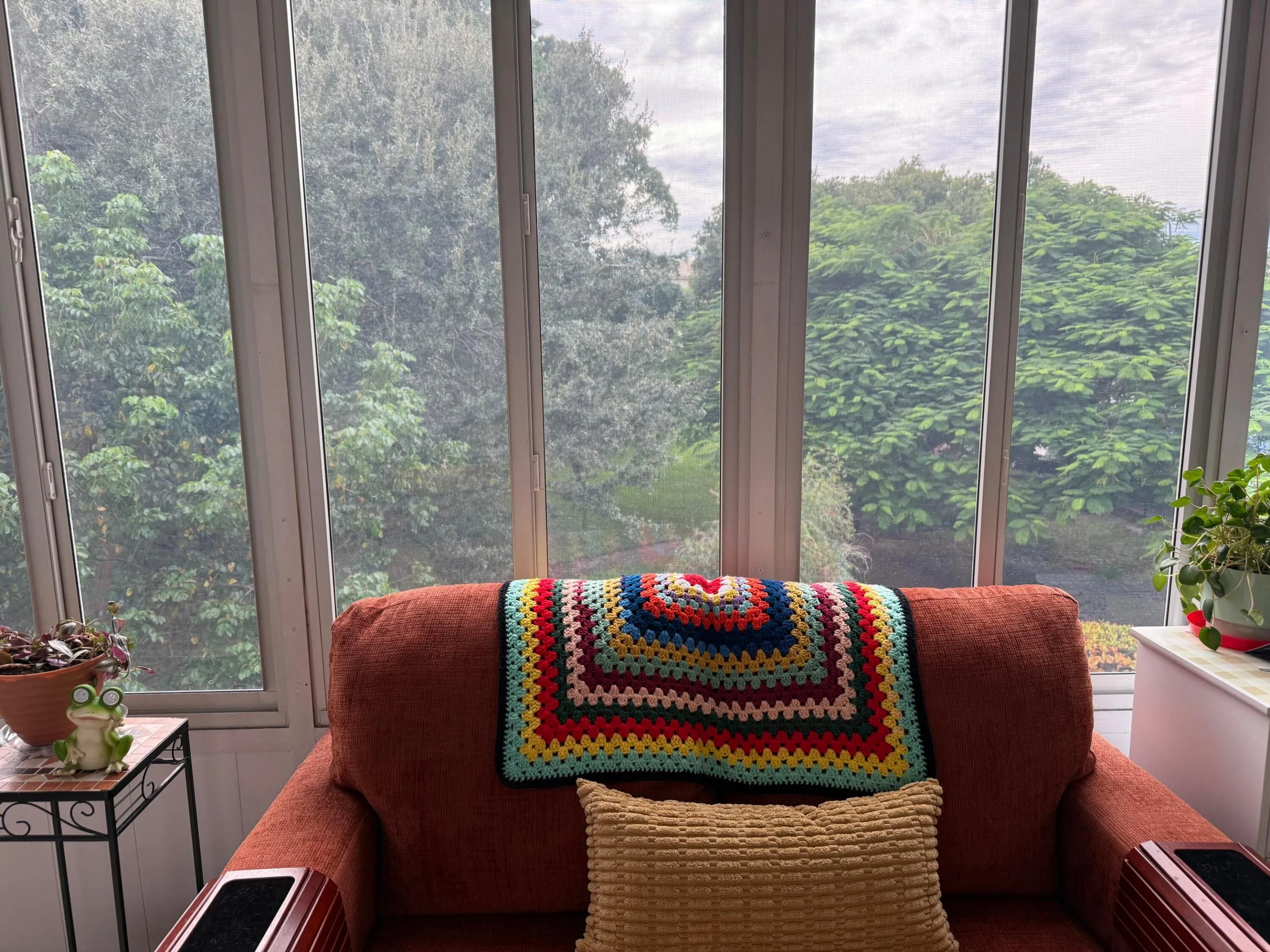 Sunroom with multiple floor-to-ceiling windows