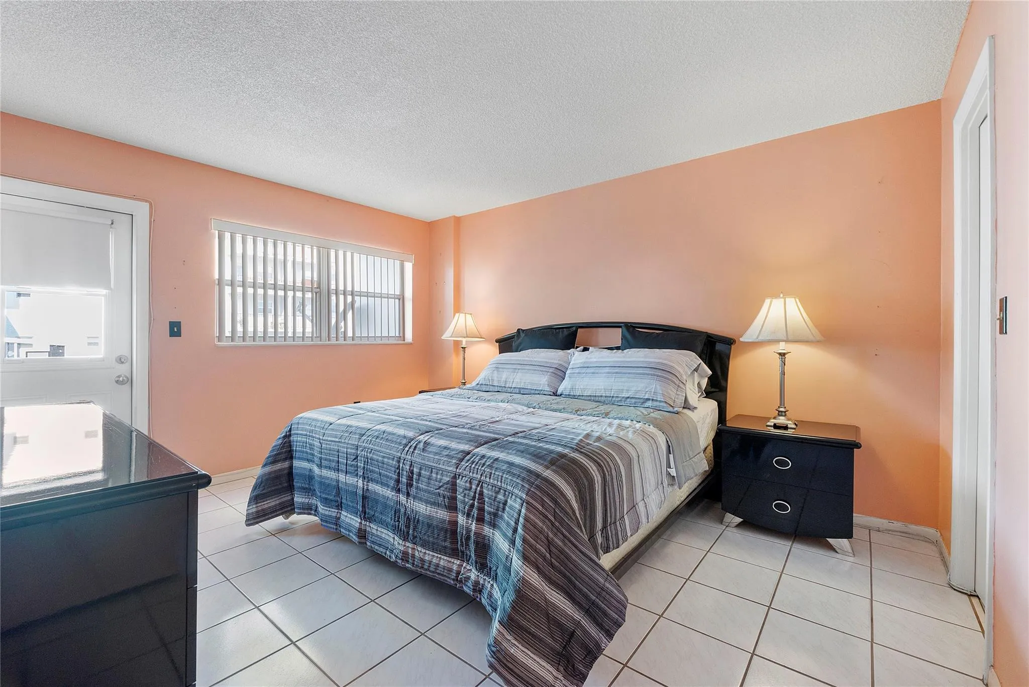 Primary bedroom with balcony