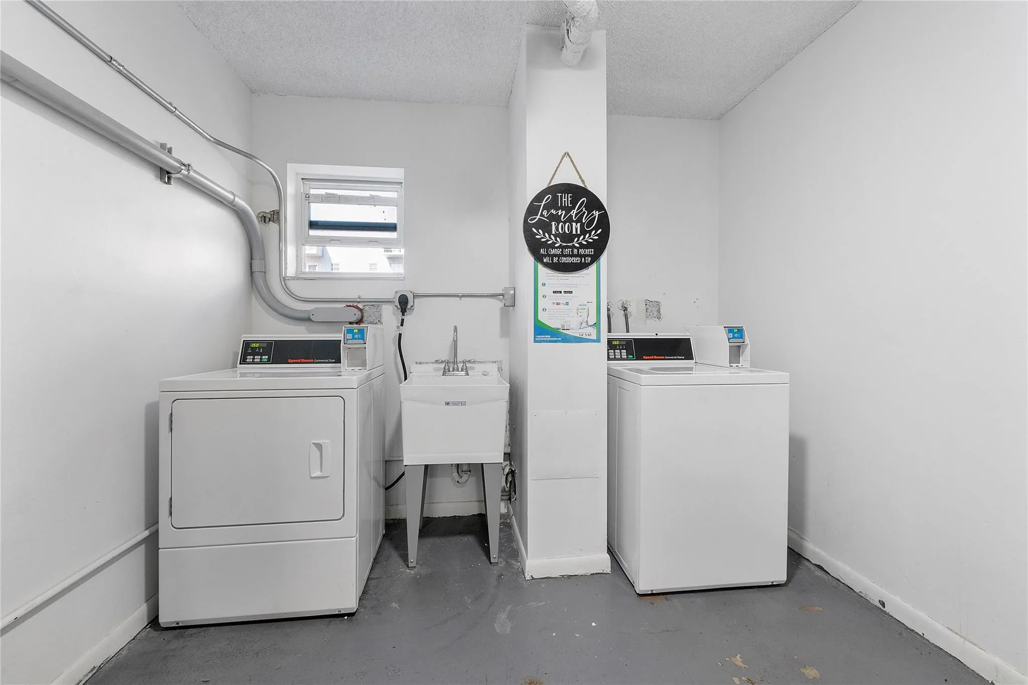 Laundry facility two doors down from unit