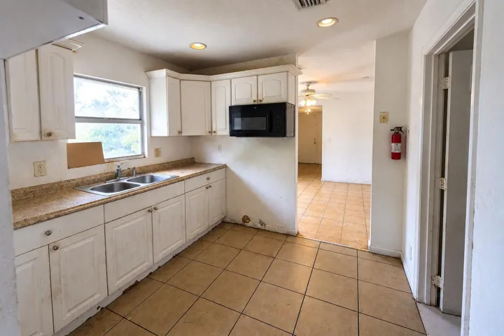 Kitchen with Sunlit Hallway