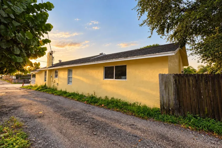 Golden-Hour Yellow Stucco House