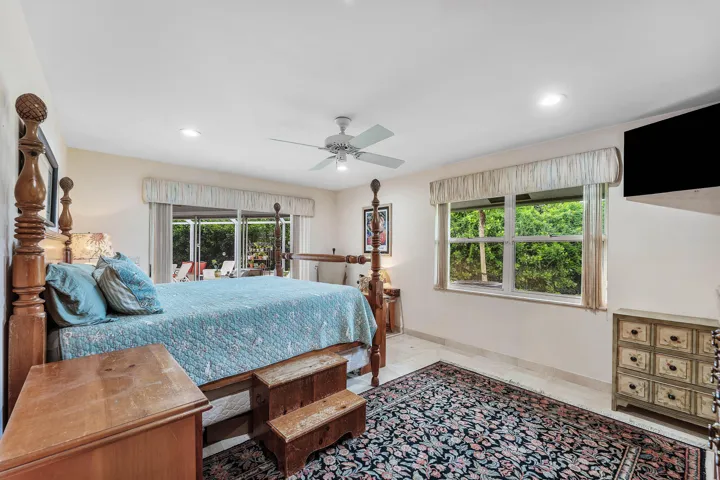 Recessed ceiling lighting, a ceiling fan, and tile flooring
