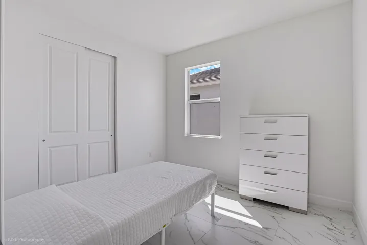 Secondary bedroom with upgraded tile floors