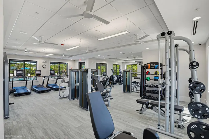 Fitness center with a variety of machines, free weights, and cardio equipment.